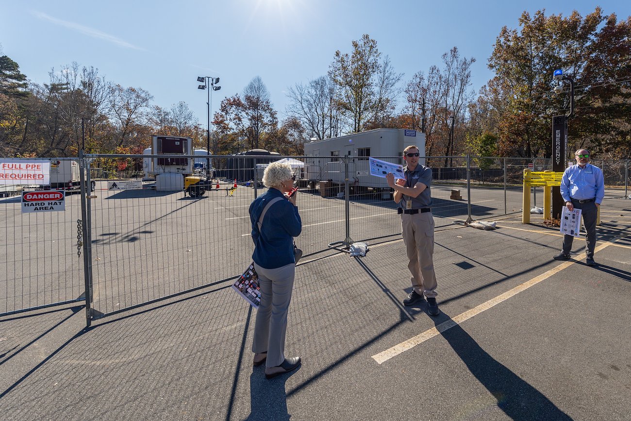 Director of Emergency Management Matt Petty (middle) explains the water treatment system built on campus by the U.S. Army Corps of Engineers.