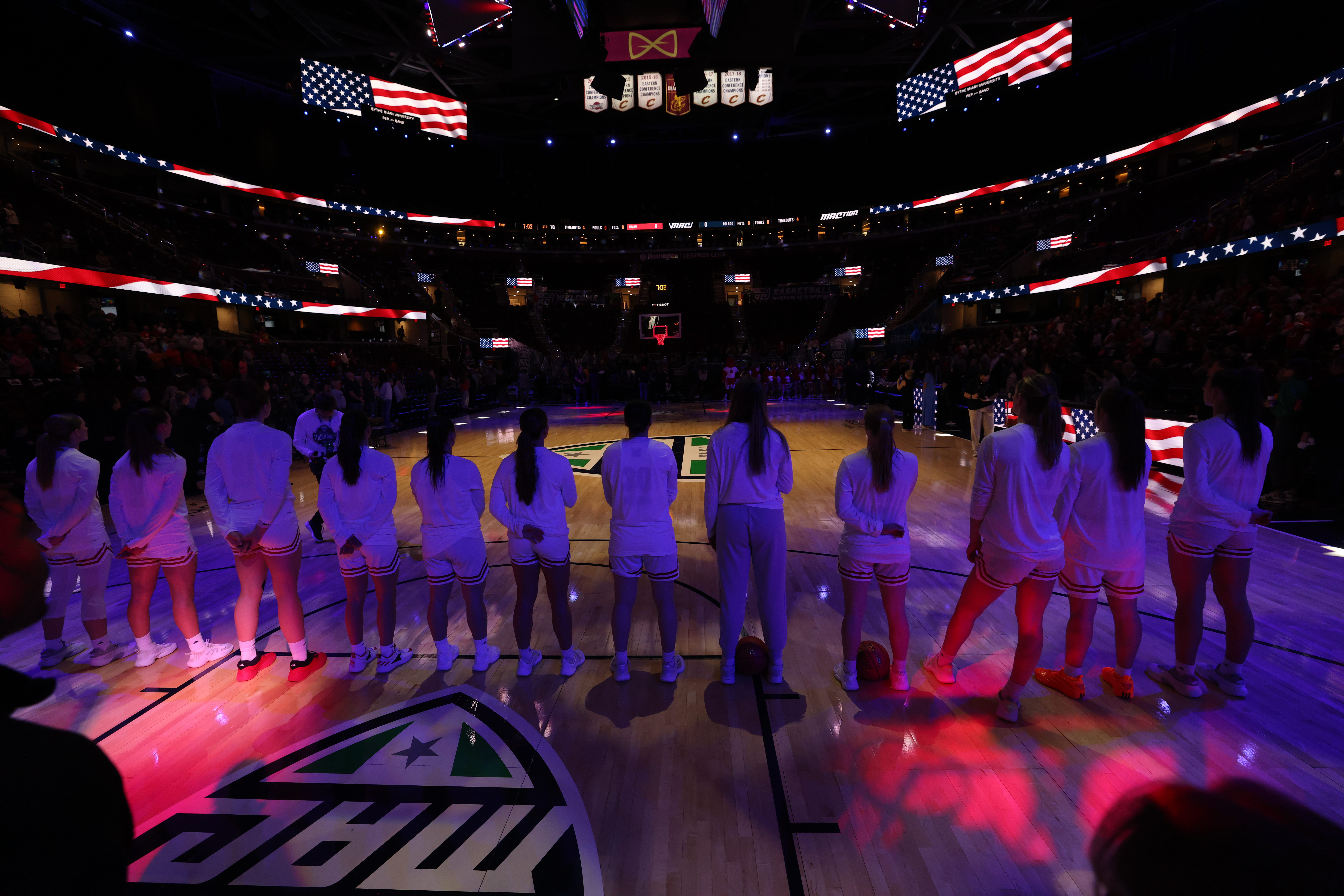 Women's basketball team stands on court during the MAC Tournament 2026 ...