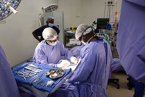 Dr. Rick and Nurse Philani deep in concentration during surgery.