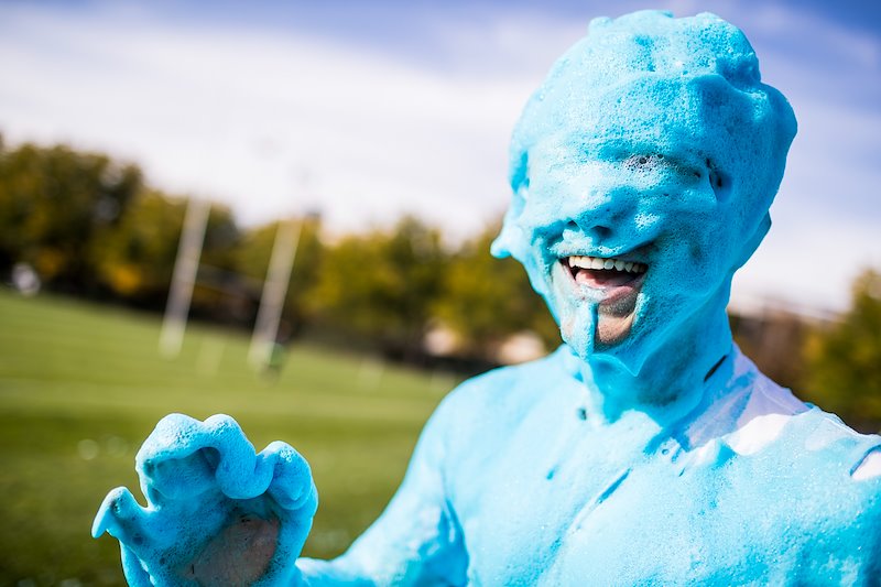 Student participating in True Blue Foam during homecoming week - Photo by Nate Edwards/BYU