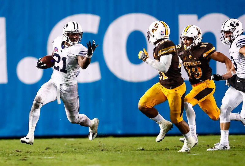 Jamaal Williams takes on Wyoming defenders during the Poinsettia Bowl in San Diego, CA - Photo by Jaren Wilkey/BYU