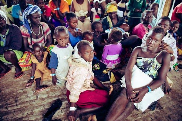 White bands identify the children that have arrived without their parents or guardians.