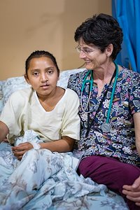 Nurse Susan Michaud with Jeylin following her surgery. Susan was also born with a cleft lip and palate.