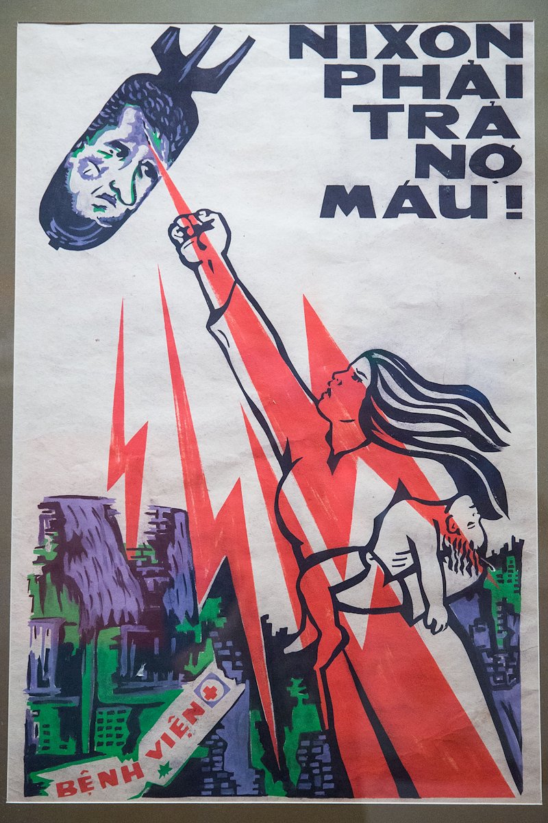 This propaganda poster reads, "Nixon owes the Vietnamese a debt of blood."