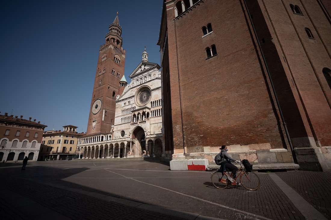 The Piazza del Comune in Cremona, with its belltower, cathedral, and baptistry dating from the 12th century, is nearly empty due to a country-wide quarantine in the effort to stop the spread of COVID-19 in Italy.