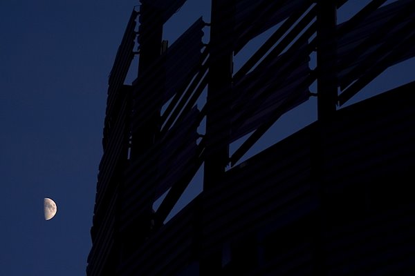 The moon over the Henry Madden Library.
