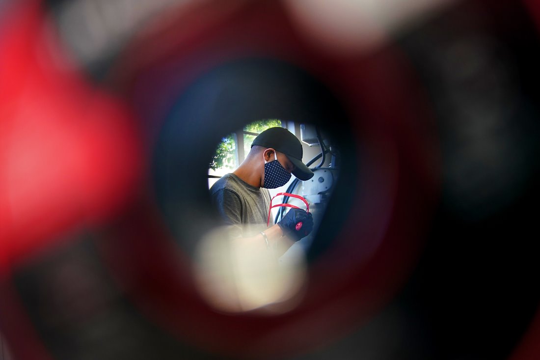 Mandeep Singh works on a custom face shield in the Engineering West Building. Singh worked with other students and faculty from Fresno State’s Lyles College of Engineering to create shields using 3D printers.
