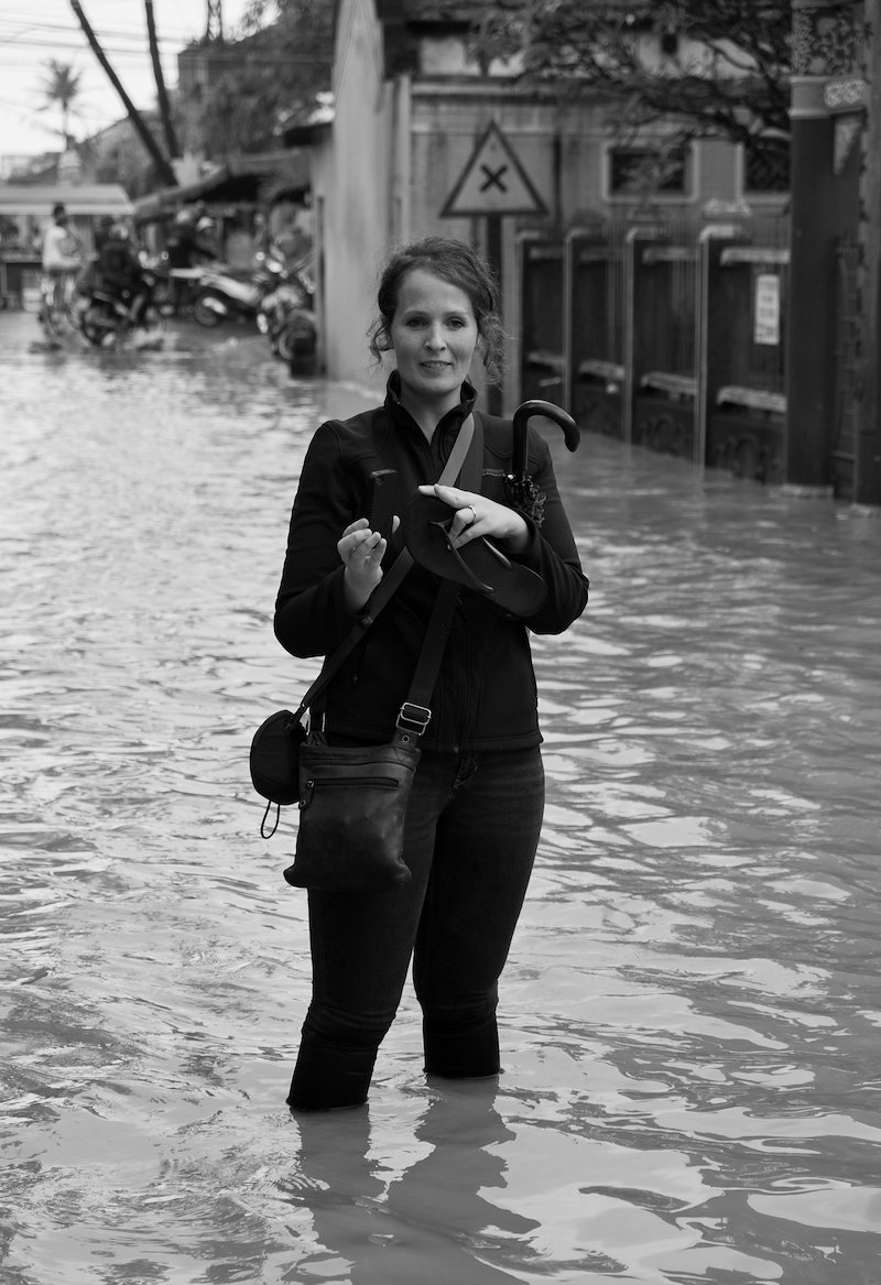 Sarah, a little way from the main river, in a flooded street.