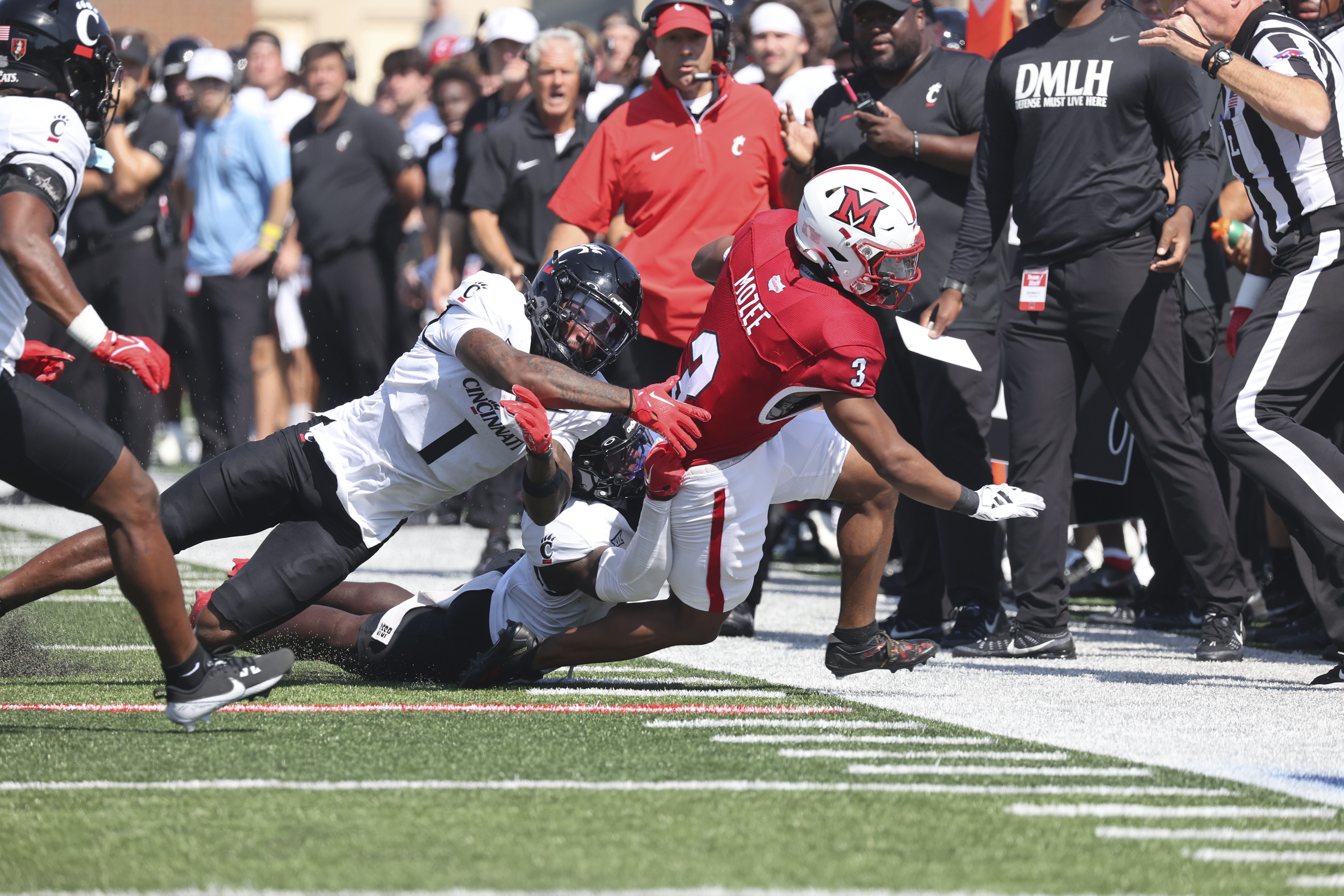 Miami's Keyon Mozee (3) runs the ball against Cincinnati on Sept. 14.