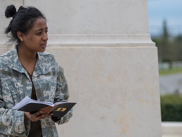 Sabriyya Pate presents as Newton Baker in front of the monument.