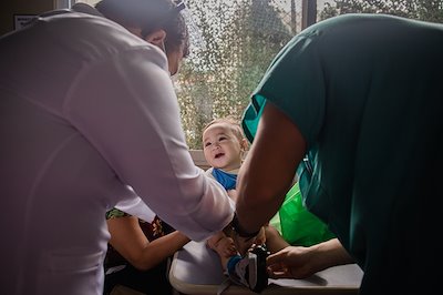 Dr. Rayray loves giving tickles to babies.