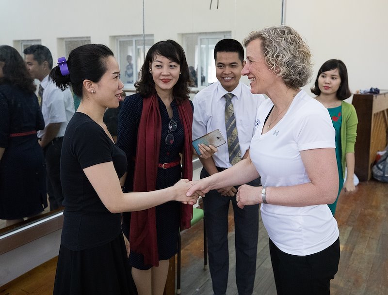 Jeanette Geslison meets with teachers at the Vietnam Dance Academy. Photo by Jaren Wilkey/BYU