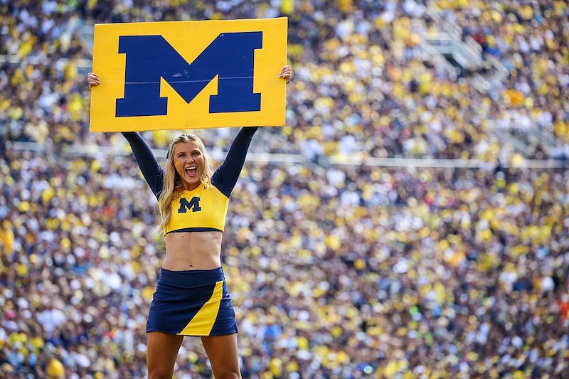 As is tradition, cheerleaders direct the crowd to spell out M-I-C-H-I-G-A-N.