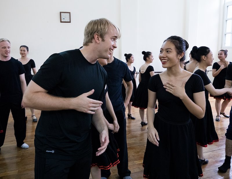 Christian Halversen meets students at the Vietnam Dance Academy. Photo by Jaren Wilkey/BYU