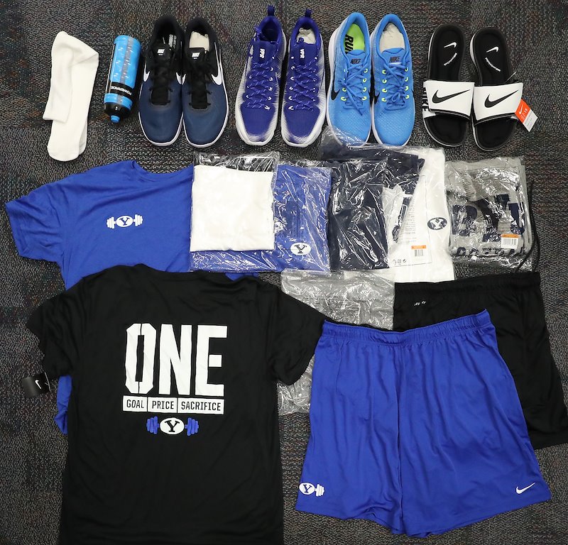 Players are issued a few bags of workout gear and shoes for Fall Camp. Photo by Jaren Wilkey/BYU