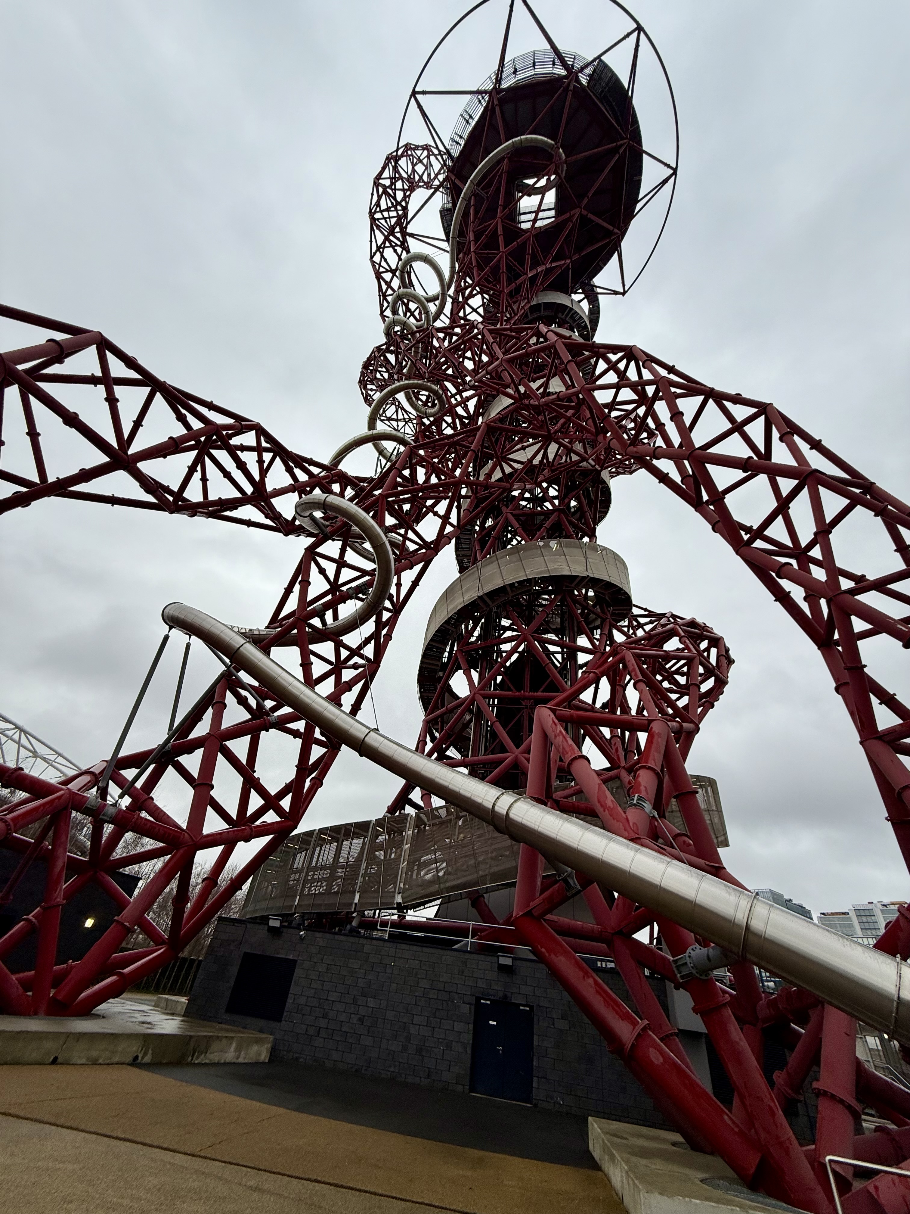 The ArcelorMittal Orbit sculpture in London rises against a cloudy sky ...
