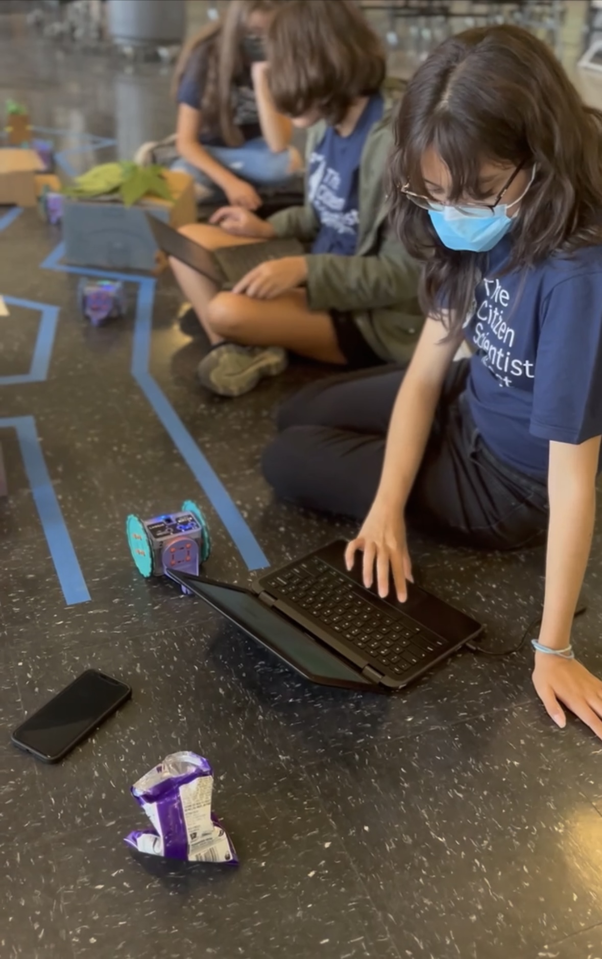 Students participate in computer science work.