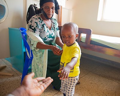 Aramazan is reaching out to our Storyteller as he learns how to walk.