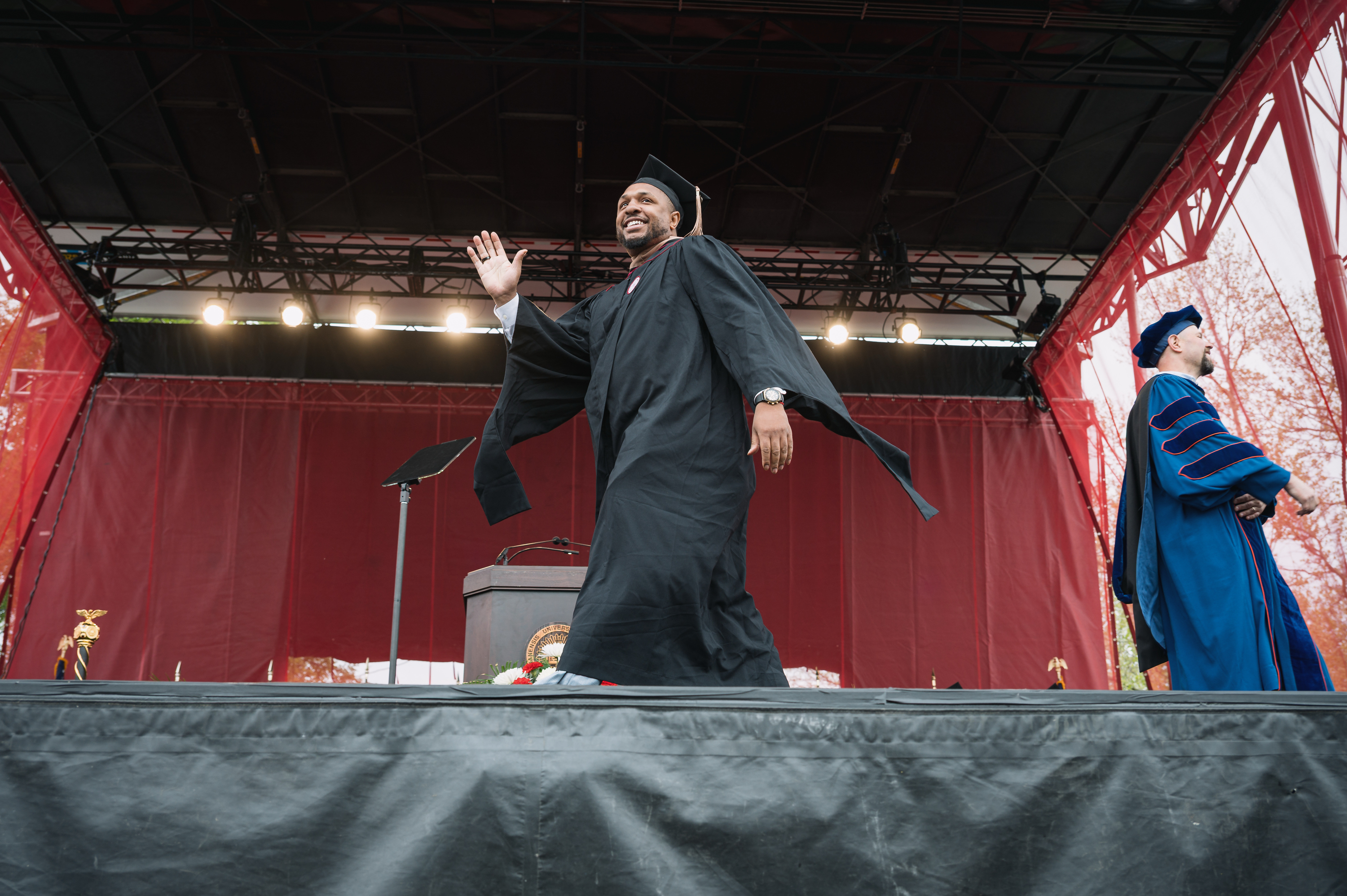 A graduate walks across stage during the IU Northwest Commencement in ...