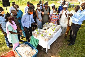 Head of departments cut a cake suring our most recent staff event.