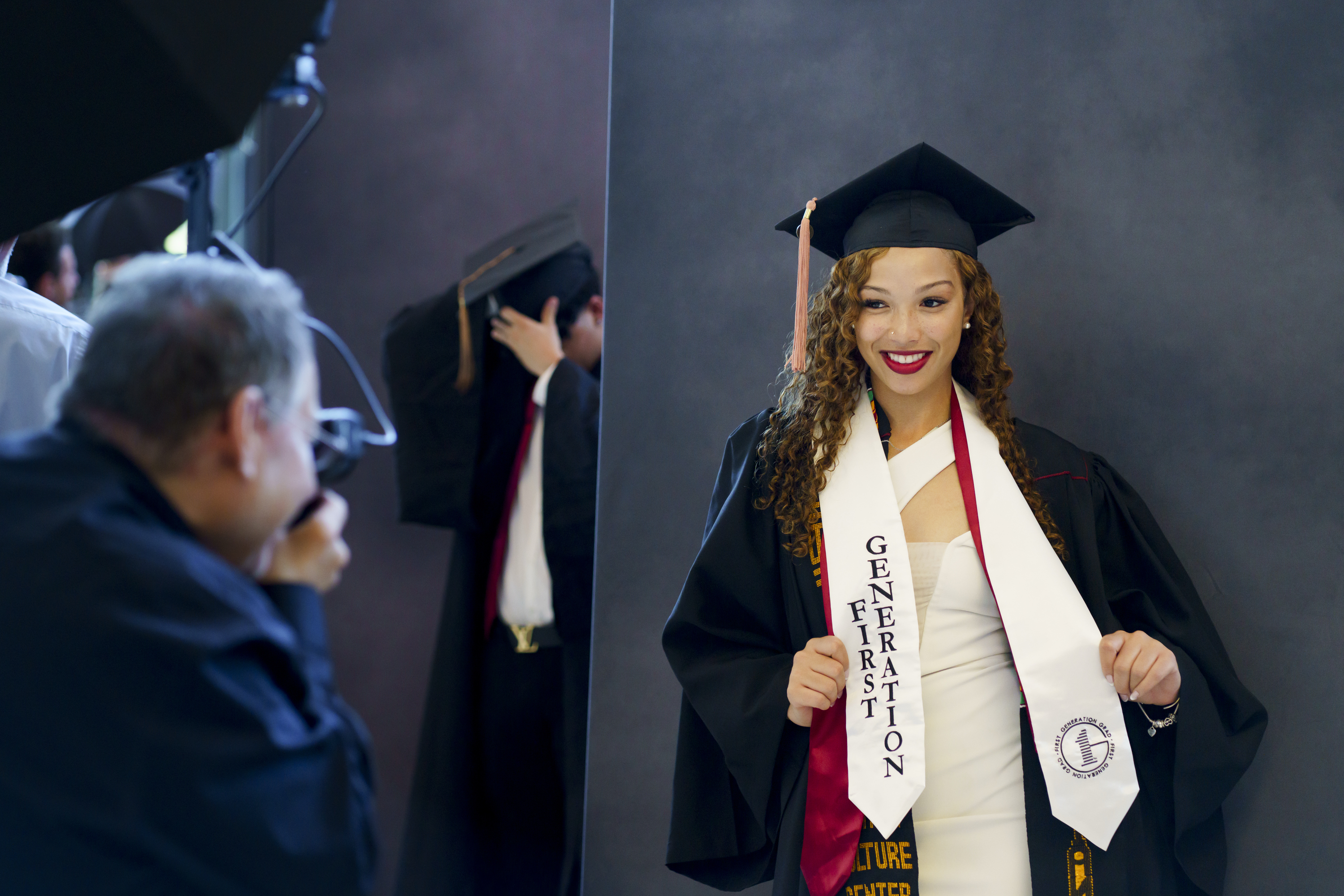 A graduate poses for a portrait before the IU Bloomington Undergraduate ...