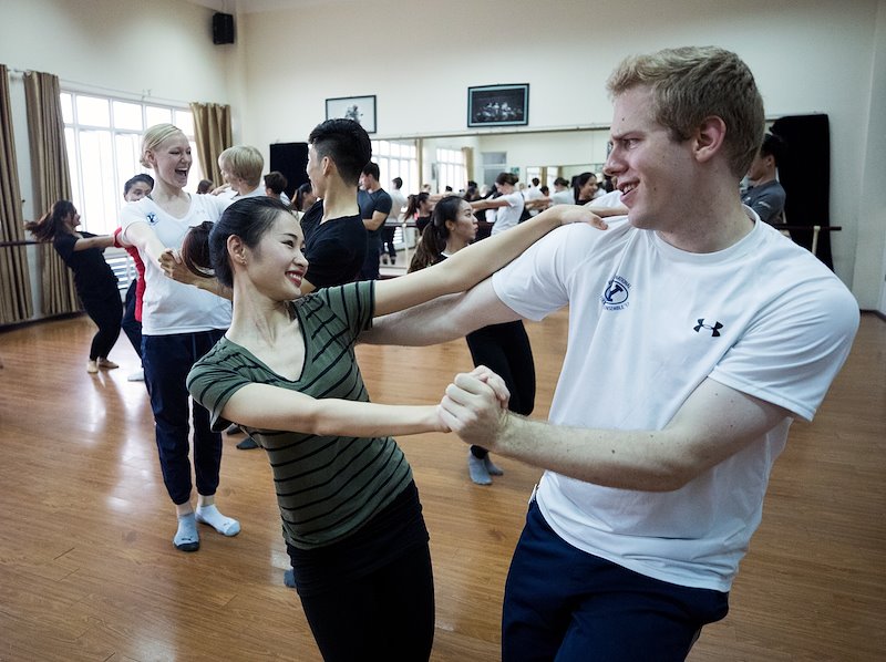 Abram Allred dances with a student from the Hanoi Academy of Theatre &amp; Cinema. Photo by Jaren Wilkey/BYU
