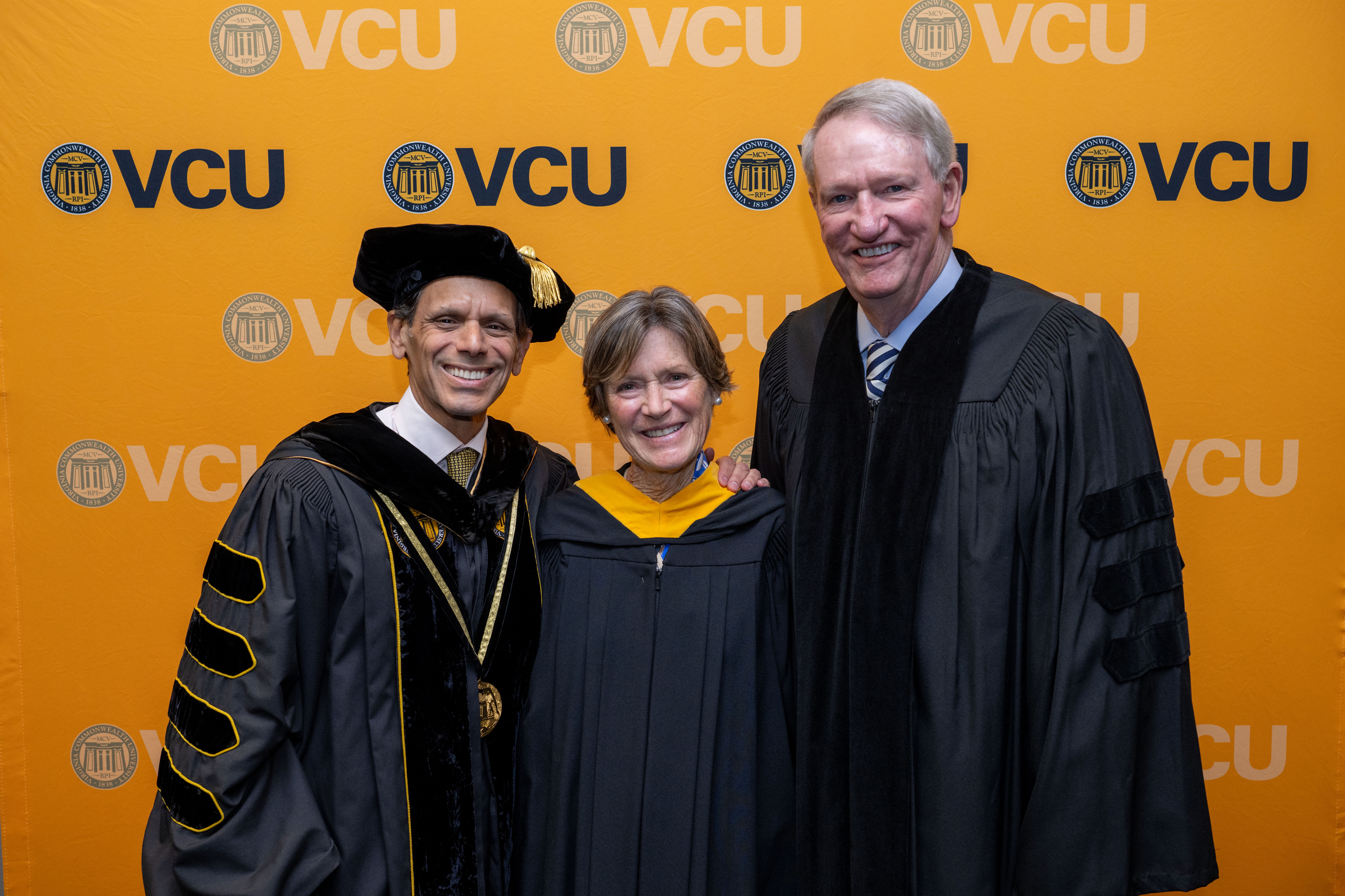 VCU President Michael Rao poses for a photo with Kathy and Rick Wagoner ...