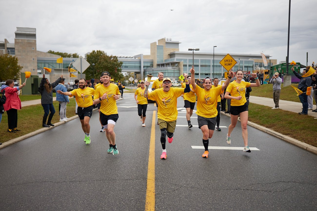 The team was greeted by cheering Profs and music from the Pride of the Profs Marching Band as they triumphantly delivered the Torch of Knowledge to Rowan's Homecoming celebration.