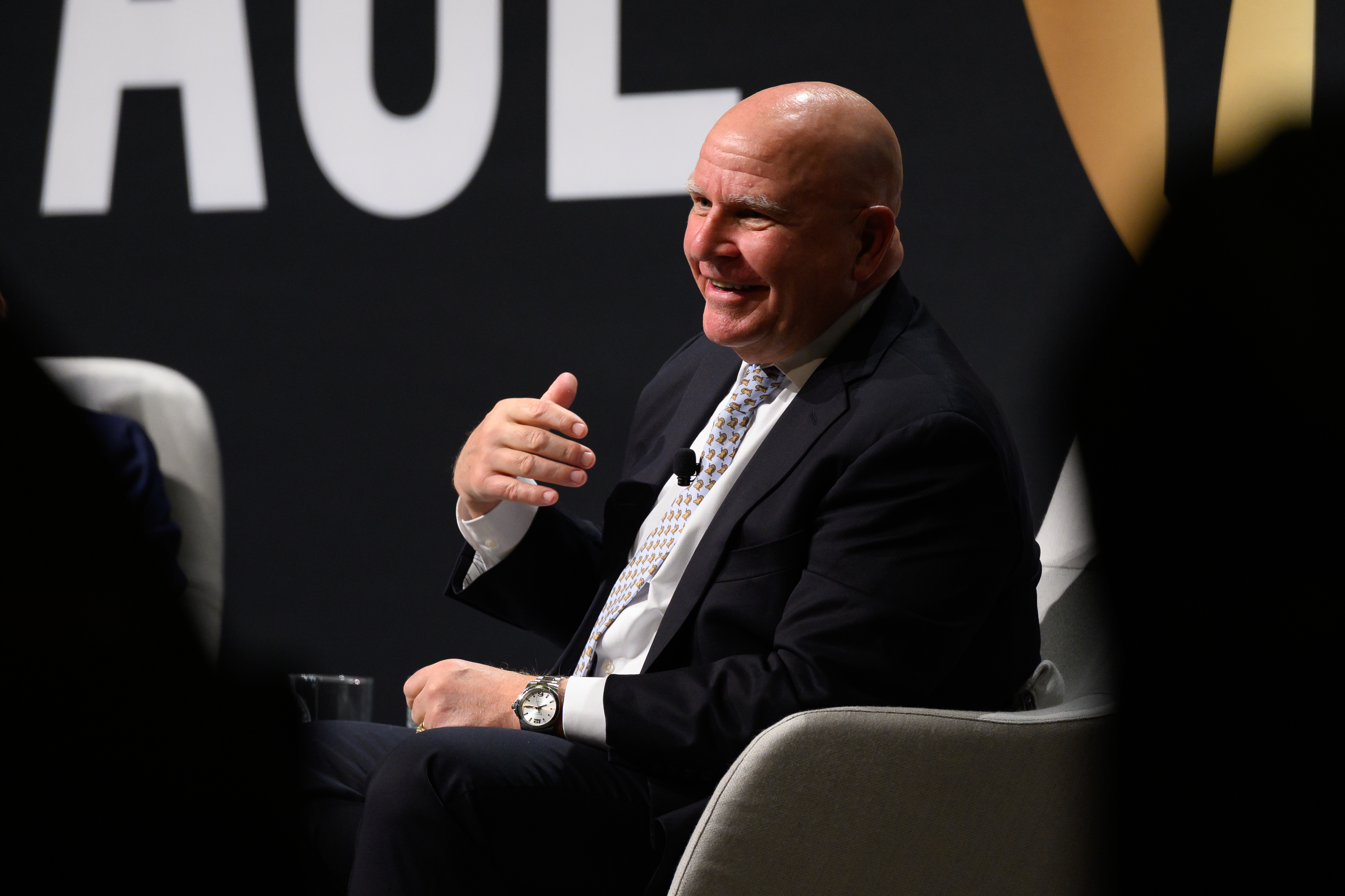 Lt. Gen. H. R. McMaster sits smiling in a chair, gesturing with his ...