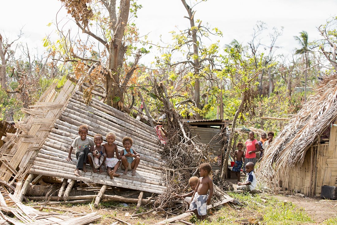 Sitting on a pile of debris from their home, these children sang "Go Tell It on the Mountain" at the top of their lungs.