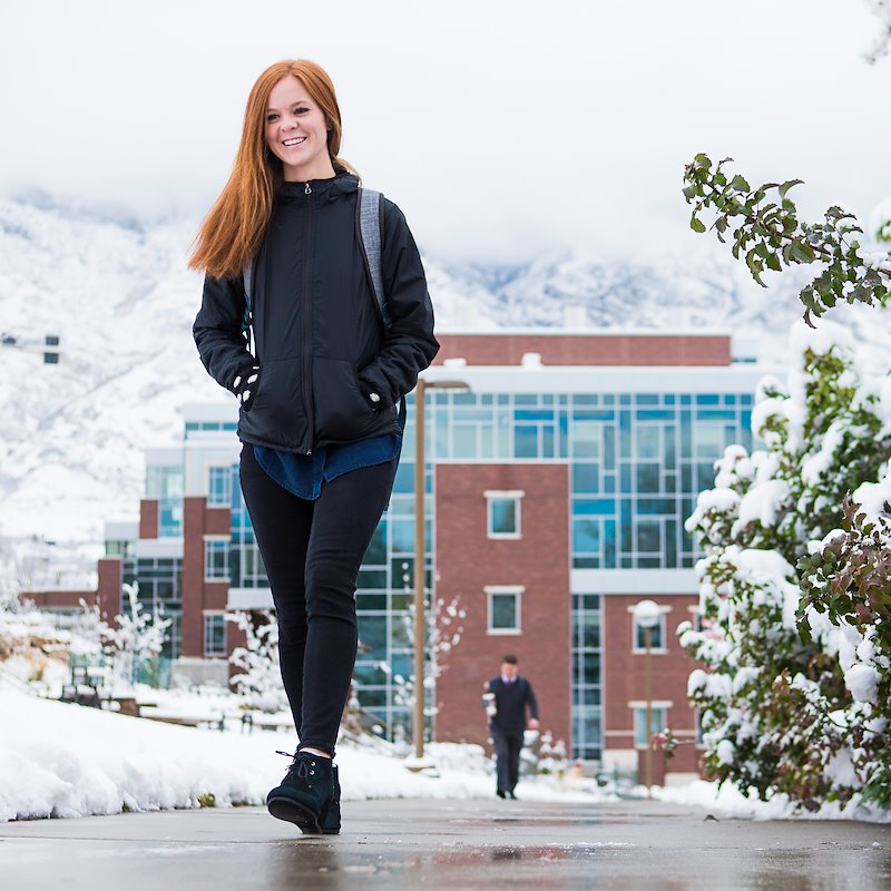 Student walks across the BYU campus after snowfall - Photo by Aaron Cornia/BYU