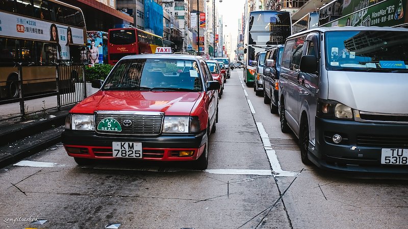 The ever famous Red Taxis of HK.