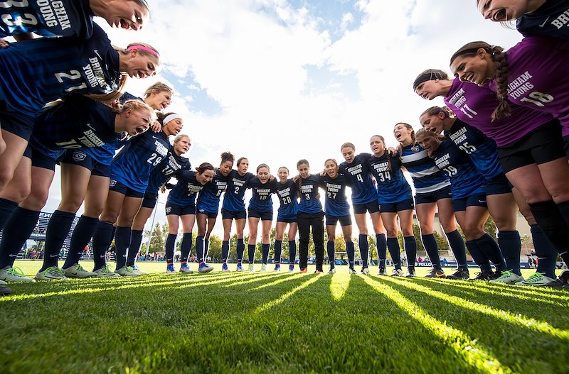 Members of the women's soccer team huddle up before their game against San Francisco - Photo by Jaren Wilkey/BYU
