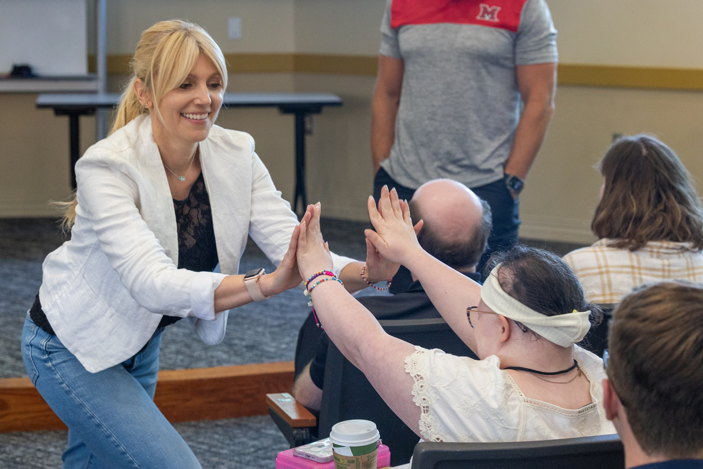 Ashley Cartell Johnson, creator of the AMP program, high-fives AMP ...