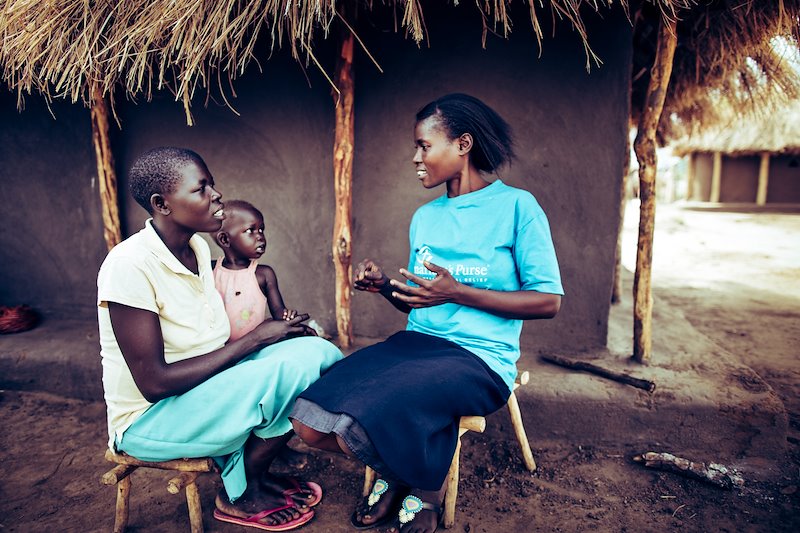 A Samaritan's Purse hygiene promoter shares with a mother about ways she can help keep her children healthy.