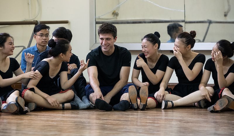 Branson Handy is the center of attention at the Vietnam Dance Academy. Photo by Jaren Wilkey/BYU