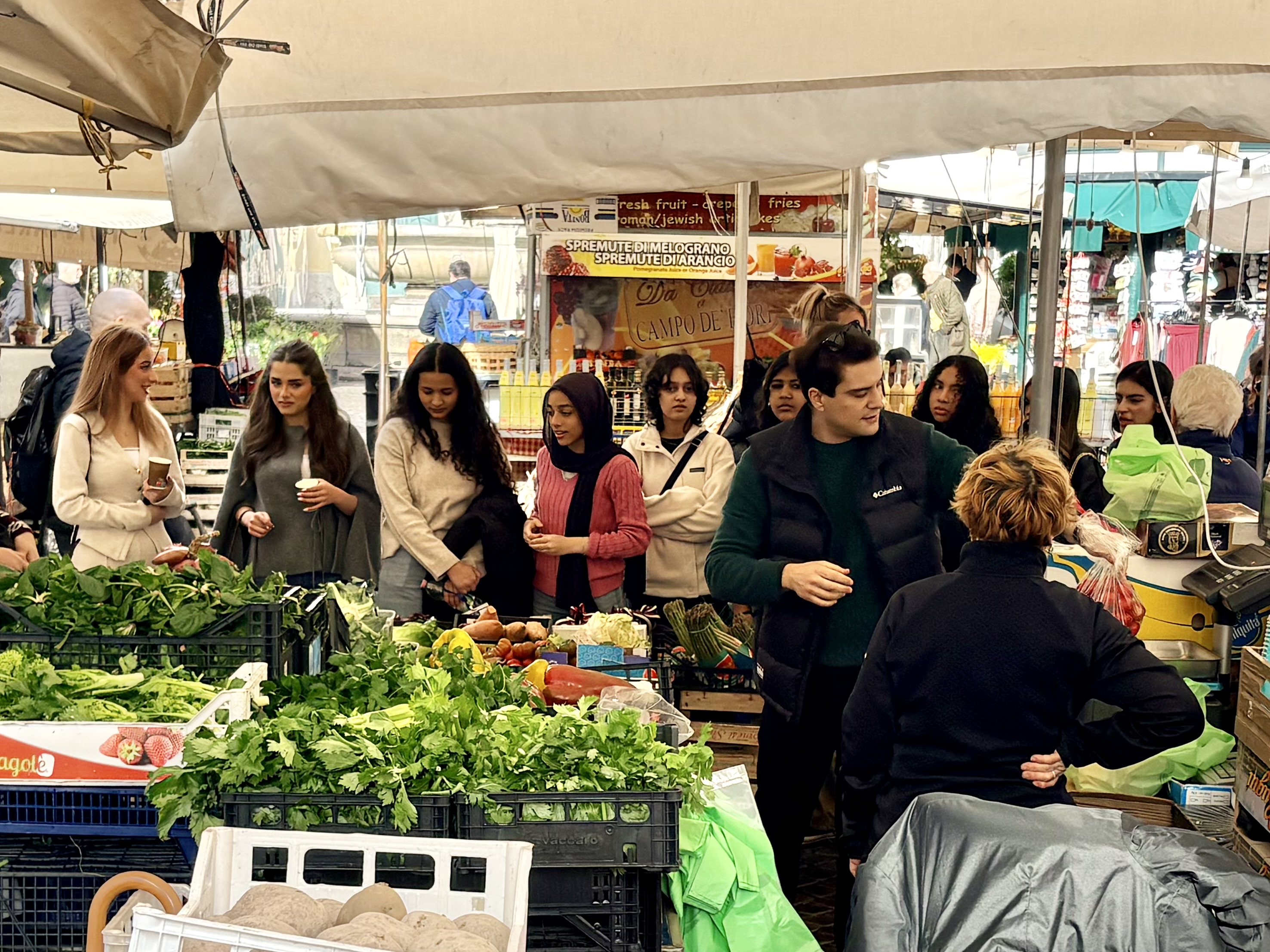 A group of students from RGS Riyadh visits an outdoor market in Italy ...