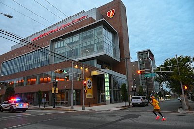 Peter Rattigan, dean of the Rita &amp; Larry Salva School of Nursing &amp; Health Professions, took the first leg through Camden, passing Cooper Medical School of Rowan University.