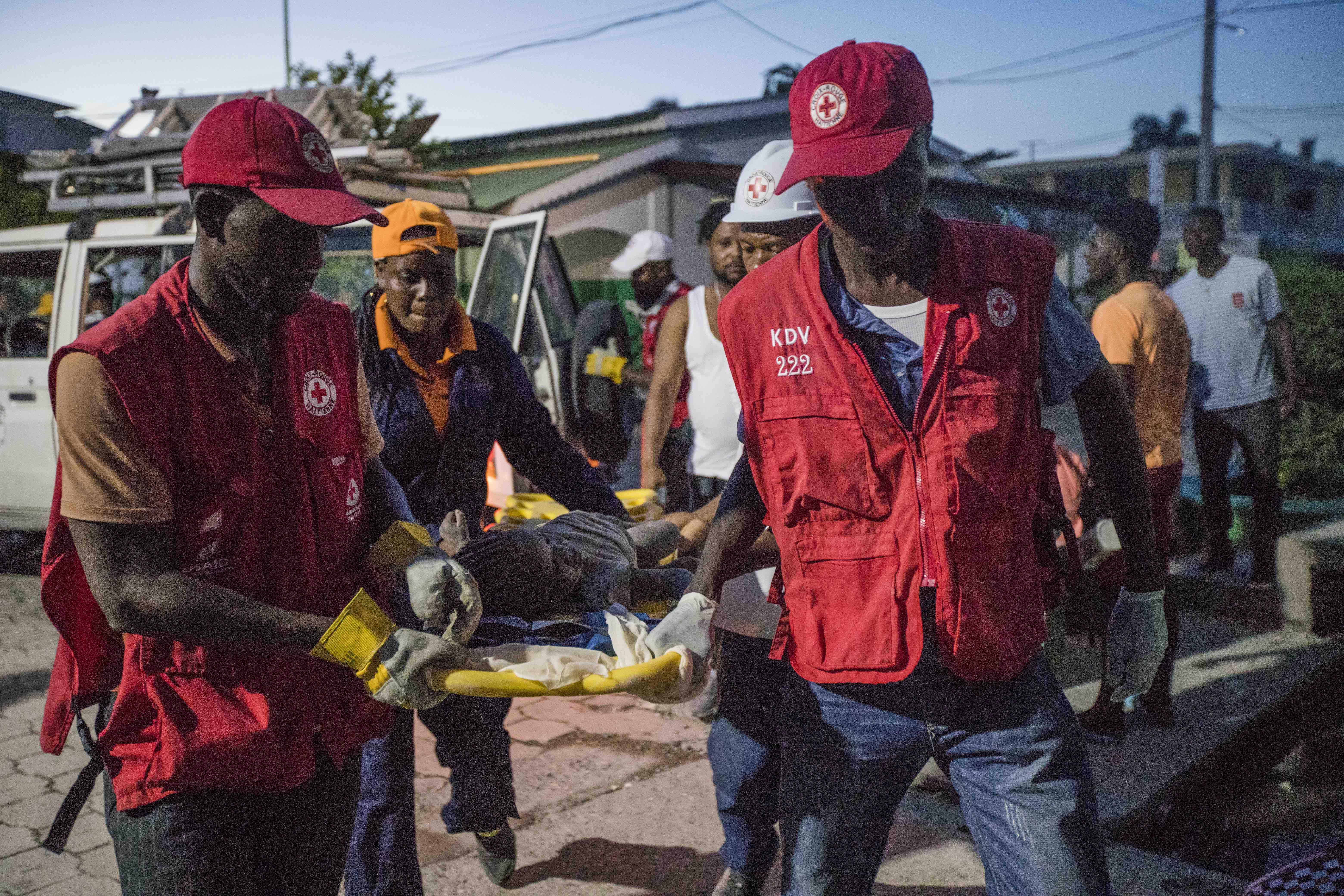 Haitian Red Cross volunteers evacuate an injured person. ©UNFPA/Ralph ...