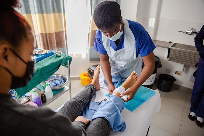 Nurse Chieta checked Beckham-Lee's operation site and gave her a new dressing.