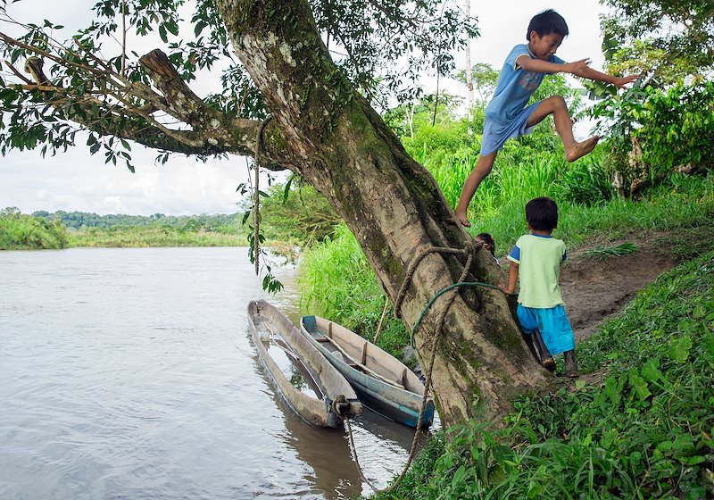 Children play on the banks of the Napo River in Tena, Ecuador.