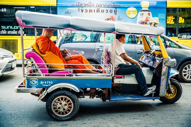Tuk-tuks are often said to only be used by tourists, but here a monk sits in one, waiting for the Bangkok traffic to clear.