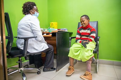 John is enjoying a conversation with the Laboratory Tech before some of his blood is drawn for tests.