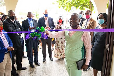 Pastor Fred, our spiritual director, cuts the ribbon to our new chapel.