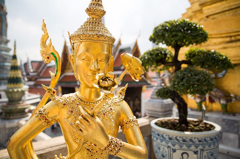 A statue of a kinnara or mythological Buddhist half-human, half-bird character at Wat Phra Kaew.