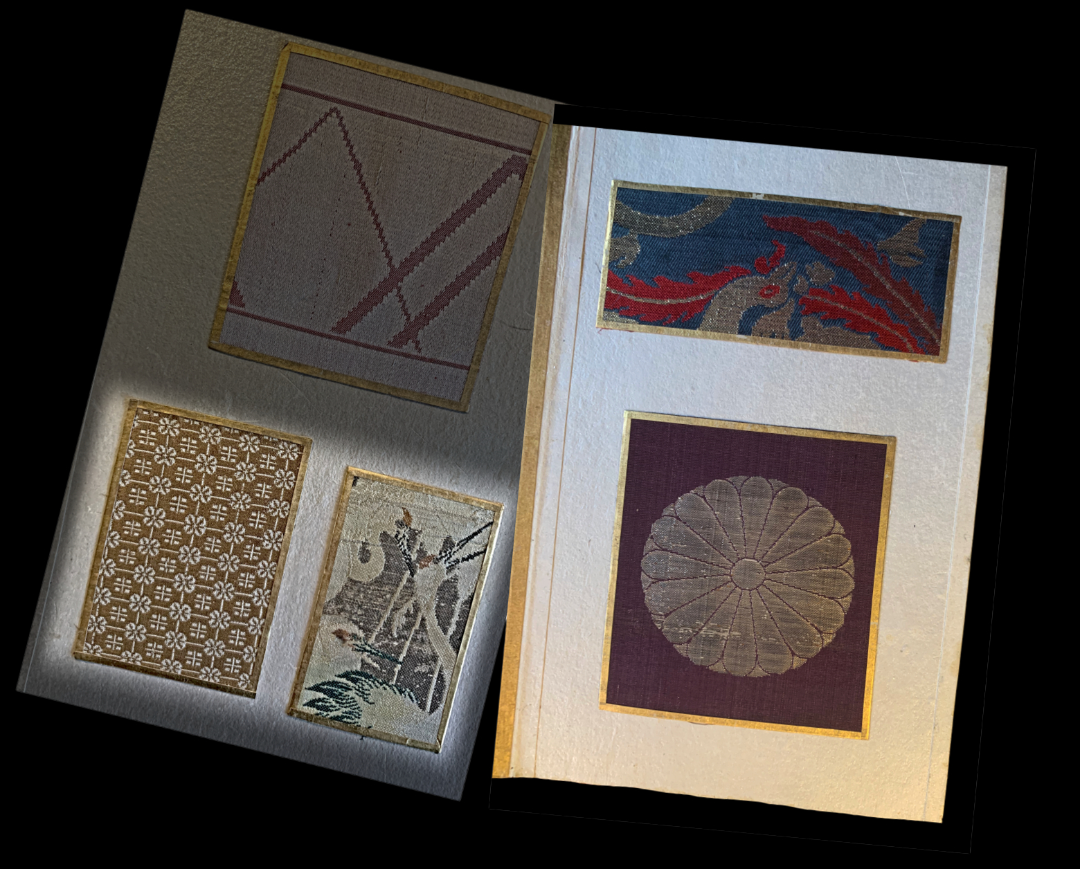Open Japanese sample catalogue showing fabric swatches with gold ...