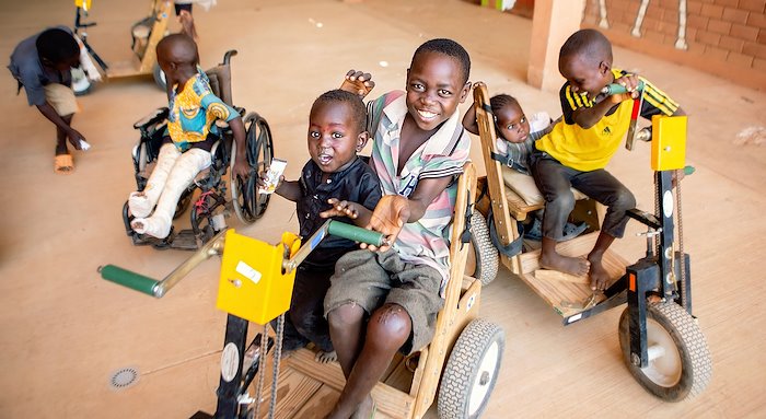 Issoufa and his friends enjoying tricycle rides.