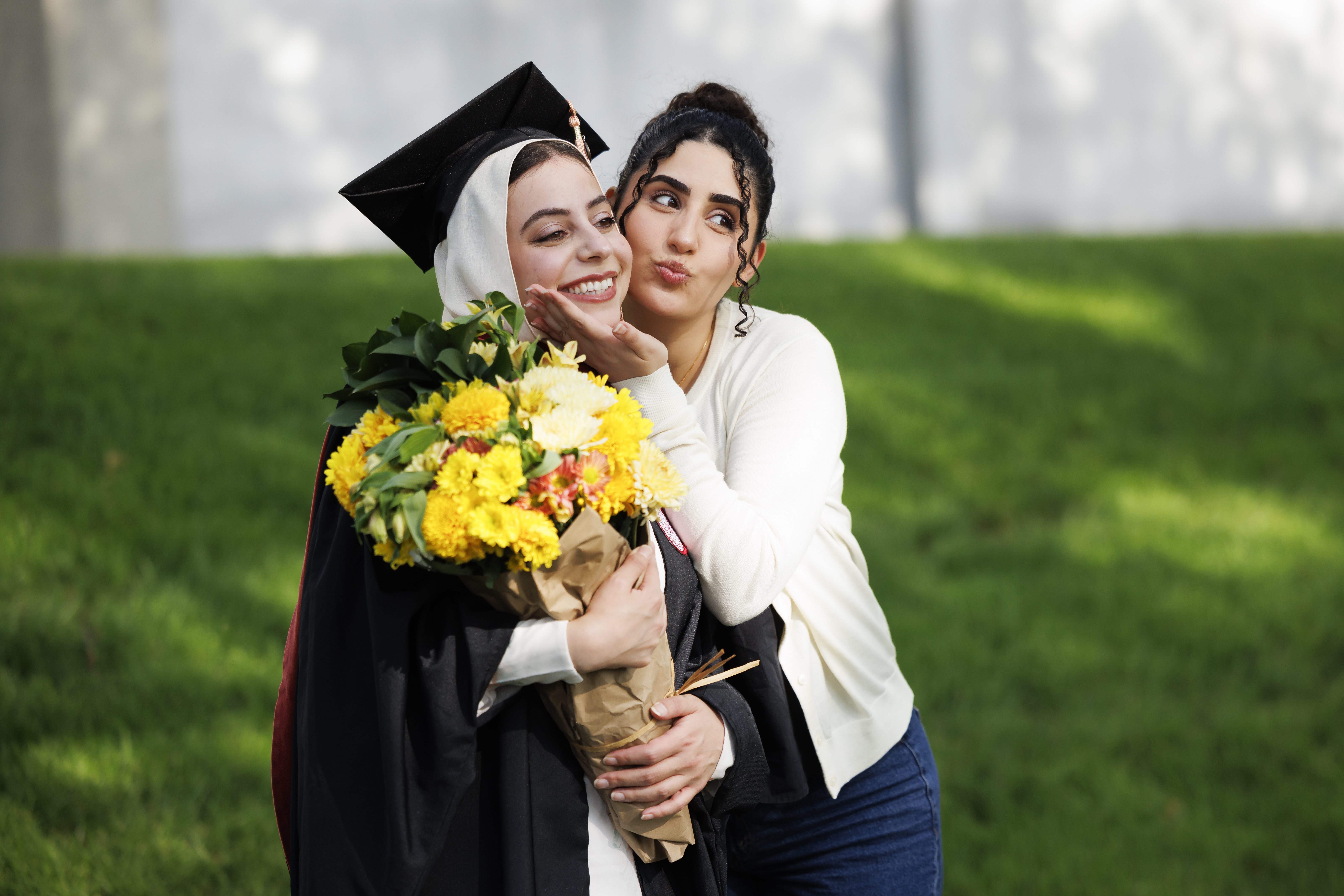 A graduate poses for a photo before the IU Indianapolis Commencement on ...