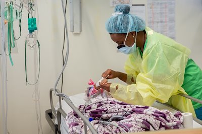 Nurse Mahlet taking care of a child after surgery.