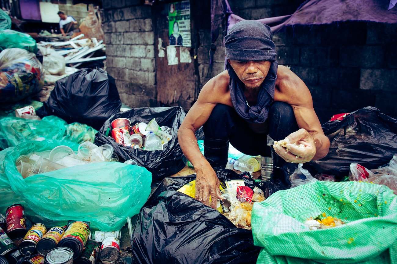 Scavenging for already-eaten food that can be recooked and sold is a common source of income in Tondo.